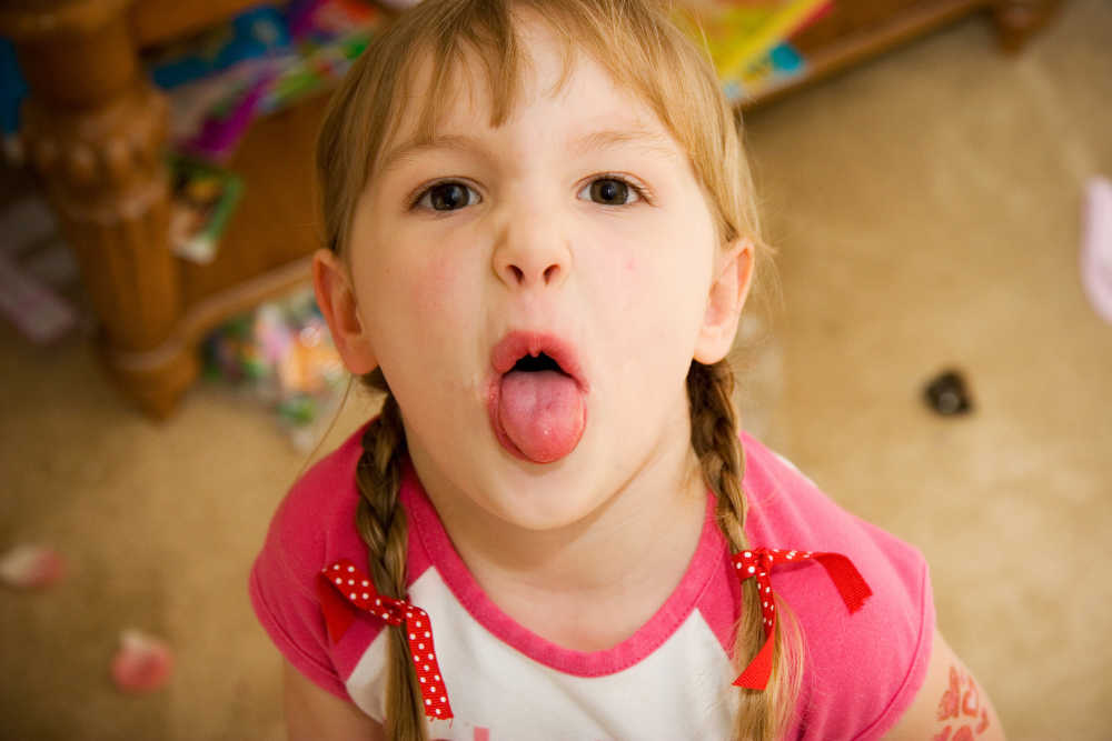 Child showing defiant behavior during sensory meltdown