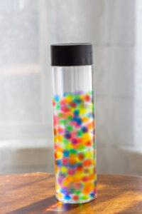 close up shot of water bead sensory bottle