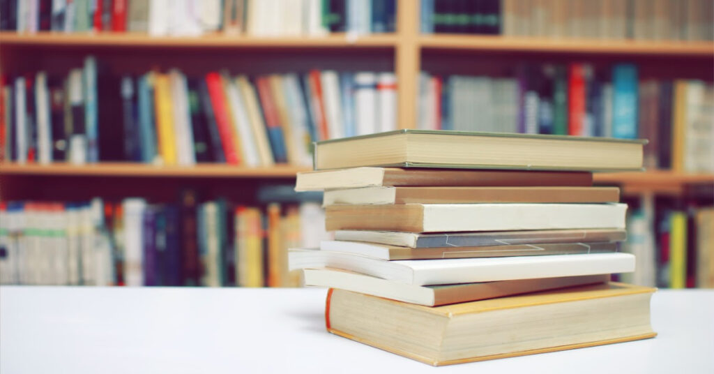 A pile of books in a library